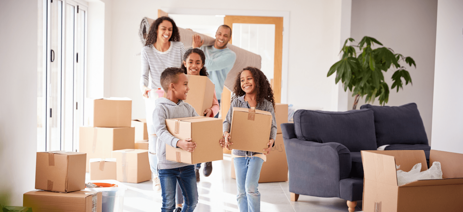 Happy family moving in to their new home thanks to Onetime Mortgage LLC